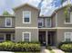 Charming two-story townhouse with well-maintained landscaping and a welcoming entrance at 2349 Willimette Dr, Wesley Chapel, FL 33543