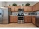 Spacious kitchen with stainless steel appliances, abundant cabinetry, and stylish countertops at 2349 Willimette Dr, Wesley Chapel, FL 33543