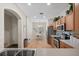 Well-lit kitchen with modern appliances and ample countertop space, leading to a cozy dining area at 2349 Willimette Dr, Wesley Chapel, FL 33543