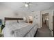 Spacious primary bedroom with plush bedding, decorative accents, and convenient access to the en-suite bathroom at 2349 Willimette Dr, Wesley Chapel, FL 33543