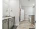 Bathroom featuring a walk-in shower, a bathtub, and neutral cabinets at 2518 Chapel Oak Bnd, Wesley Chapel, FL 33543