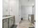 Bathroom featuring a walk-in shower, a bathtub, and neutral cabinets at 2518 Chapel Oak Bnd, Wesley Chapel, FL 33543
