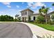Community center featuring well-maintained landscaping, light-colored stucco and siding, and an entrance walkway at 2518 Chapel Oak Bnd, Wesley Chapel, FL 33543