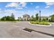 Community center featuring well-maintained landscaping, light-colored stucco and siding, and an entrance walkway at 2518 Chapel Oak Bnd, Wesley Chapel, FL 33543