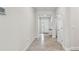 Bright foyer with stylish tile floors, a charming accent table, and an inviting entryway at 2518 Chapel Oak Bnd, Wesley Chapel, FL 33543