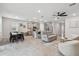Spacious open floorplan with kitchen island, dining area, and comfortable living space at 2518 Chapel Oak Bnd, Wesley Chapel, FL 33543