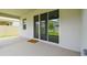 Covered patio with sliding glass doors and a view of the backyard at 2518 Chapel Oak Bnd, Wesley Chapel, FL 33543