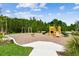 Community playground with a variety of play equipment, including swings, slides, and climbing structures at 2518 Chapel Oak Bnd, Wesley Chapel, FL 33543