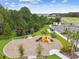 A playground that includes seating, a modern slide, and an adjacent parking area at 2518 Chapel Oak Bnd, Wesley Chapel, FL 33543