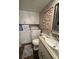 Bathroom with laundry, seashells decoration, and a vanity with solid surface countertops at 2716 11Th Ct, Palm Harbor, FL 34684