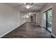 Well-lit room features sliding glass doors leading to a balcony and mirrored closet doors at 2716 11Th Ct, Palm Harbor, FL 34684
