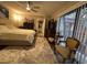 Cozy bedroom featuring a plush rug, comfortable bed, and bright natural light from the large windows at 2716 11Th Ct, Palm Harbor, FL 34684