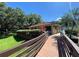 Charming community clubhouse with a red tile roof and beautiful landscaping at 2716 11Th Ct, Palm Harbor, FL 34684