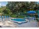 Inviting community hot tub with comfortable seating and a shaded area at 2716 11Th Ct, Palm Harbor, FL 34684