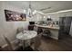 Eat-in kitchen featuring stainless steel appliances, granite countertops and a dining area at 2716 11Th Ct, Palm Harbor, FL 34684