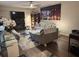 A comfortable living room featuring sofas, city artwork and hardwood floors, creating a stylish, relaxing space at 2716 11Th Ct, Palm Harbor, FL 34684