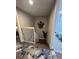 View of the staircase leading down, showing railing and wall art at 2716 11Th Ct, Palm Harbor, FL 34684