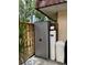Outdoor storage cabinet and water filtration unit in a fenced area at 2716 11Th Ct, Palm Harbor, FL 34684