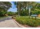 Street view of the Wedgewood community entrance, showcasing lush landscaping and neighborhood signage at 2716 11Th Ct, Palm Harbor, FL 34684