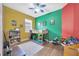 Eclectic bedroom with lofted bed, wood floors, bright colors, and natural light at 31241 Kirkshire Ct, Wesley Chapel, FL 33543