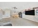 Carpeted bonus room with media center, large TV, fan and comfortable seating at 31241 Kirkshire Ct, Wesley Chapel, FL 33543