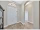 Bright foyer with tiled flooring and a view into the home's interior spaces at 31241 Kirkshire Ct, Wesley Chapel, FL 33543