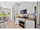 Stylish kitchen featuring stainless steel appliances and stone countertops at 31241 Kirkshire Ct, Wesley Chapel, FL 33543