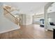Open-concept living room featuring neutral paint, hardwood floors and ample natural light at 31241 Kirkshire Ct, Wesley Chapel, FL 33543