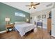 Main bedroom with hardwood flooring and an ensuite bathroom at 31241 Kirkshire Ct, Wesley Chapel, FL 33543
