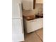 Bright kitchen features white appliances and new butcher block countertops at 320 N Bayshore Blvd # 203, Clearwater, FL 33759
