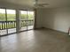 Spacious living room with tile flooring and sliding doors leading to the balcony with outdoor views at 320 N Bayshore Blvd # 203, Clearwater, FL 33759