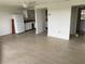 Open-concept living area with tile flooring leading to kitchen and other rooms at 320 N Bayshore Blvd # 203, Clearwater, FL 33759