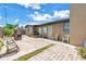 Spacious backyard with a brick BBQ, chairs and beautiful vegetation at 3743 Cherrywood Dr, Holiday, FL 34691