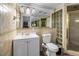 Bathroom features tile walls, a shower, and a mirrored wall at 3743 Cherrywood Dr, Holiday, FL 34691