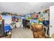 Custom decorated bedroom with a large desk and custom TV and gaming setup at 3743 Cherrywood Dr, Holiday, FL 34691