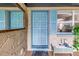 Inviting entryway featuring a decorative front door and tiled bench at 3743 Cherrywood Dr, Holiday, FL 34691