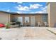 Charming single-story home with a welcoming front patio, white seating and well-maintained landscape at 3743 Cherrywood Dr, Holiday, FL 34691