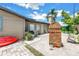 Inviting outdoor space with garden, brick chimney, and a cozy seating area at 3743 Cherrywood Dr, Holiday, FL 34691