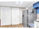 Kitchen features stainless steel refrigerator and adjacent access to storage at 3743 Cherrywood Dr, Holiday, FL 34691