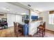 Charming kitchen boasts a breakfast bar with granite countertops and a modern, stainless steel refrigerator at 3743 Cherrywood Dr, Holiday, FL 34691