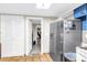 Kitchen featuring stainless steel refrigerator and adjacent access to a private office at 3743 Cherrywood Dr, Holiday, FL 34691
