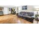 Spacious living room with tile flooring, leather couch, and game machines at 3743 Cherrywood Dr, Holiday, FL 34691