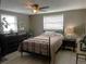 Comfortable bedroom with a ceiling fan, neutral tones, and a window for natural light at 3811 Elmwood Dr, Holiday, FL 34691