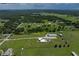 Lush acreage featuring pond and modern home, ideal for an equestrian estate or hobby farm at 4205 Old Mulberry Rd, Plant City, FL 33567
