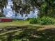 Spacious backyard with a glimpse of the outbuildings, ideal for country living at 4205 Old Mulberry Rd, Plant City, FL 33567