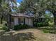 Cozy home with a front yard needing TLC, awaiting your personal touch and renovation ideas at 4205 Old Mulberry Rd, Plant City, FL 33567