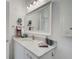 Bathroom featuring granite countertops, a large mirror, and modern fixtures at 4221 W Spruce St # 2328, Tampa, FL 33607