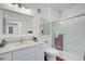 Bathroom with granite countertops, a large mirror, and a shower/tub combo at 4221 W Spruce St # 2328, Tampa, FL 33607