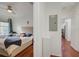 Bright bedroom featuring a comfortable bed, desk, and large window for natural light at 4221 W Spruce St # 2328, Tampa, FL 33607