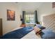 Bedroom featuring natural light, hardwood floors, and a ceiling fan at 4221 W Spruce St # 2328, Tampa, FL 33607